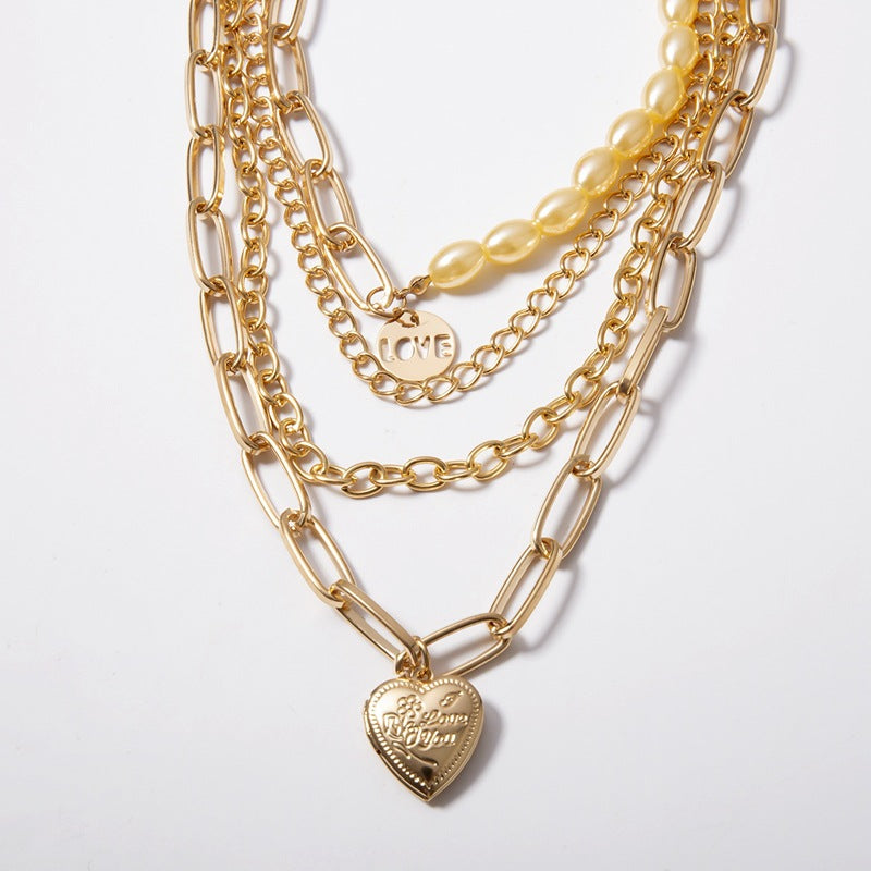 Mixed chain and pearl necklace with Love and Heart pendant